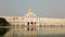 Beautiful view of Golden temple in Amritsar, a wide angle pan of golden temple at sunset in Amritsar, india,  Sikh pilgrims worshi