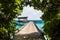 Beautiful view from the grass arch of overwater villas in the Maldives