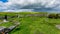 Beautiful view of the graveyard ruins of the medieval Killilagh church and its field with green grass