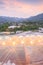 Beautiful view of greenhouse in tropical forest at twilight. Flower plants growing inside greenhouse. Organic greenhouse. Chiang