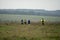 Beautiful view of a group of runners crossing a field