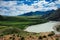 Beautiful view from hill to the confluence of two rivers under a blue sky with clouds in the Altai mountains. Amazing landscape of