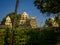 Beautiful view of a hindu temple with some sculptures around the building in a beautiful blue sky