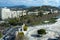 Beautiful view of the historical part of the city of Malaga with a review wheel. Castle, streets, harbor, cars