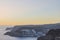 Beautiful view of hotels buildings situated on mountain landscape of Gran Canaria Island on backdrop of sunset.