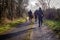 Beautiful view of hunters walking on the forest road on a cloudy day