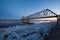 Beautiful view of ice drift under the railway bridge in Arkhangelsk, Russia. Beautiful ice motion on Northern Dvina