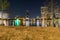 Beautiful view of illuminated buildings above a lake at night