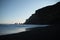 Beautiful view of the lake and the silhouette of a cliff during sunset