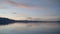 Beautiful View of Lake Tahoe at dusk with colorful reflection of clouds