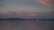 Beautiful View of Lake Tahoe at dusk with colorful reflection of clouds