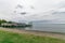 Beautiful view of Lake Trasimeno from a lonely beach. The sky i