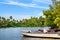 Beautiful view of the lake and tropical vegetation on the shore on a bright sunny day