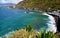 Beautiful view of Las Aguas, San Juan de la Rambla coastline with transparent turquoise blue ocean water and succulent plants.