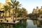 Beautiful view of Madinat Jumeirah channel and hotel with cafes during sunset