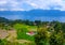 Beautiful view of Maninjau Lake with a mix of rice fields and hills seen from the 44th bend of Maninjau, West Sumatra