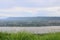 Beautiful view of the Mekong river with the mountain and cloudy sky.