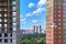 Beautiful view of the modern Moscow buildings opens between two buildings under construction