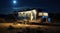 Beautiful view of motorhome outdoors at night. Summer camping