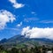 The beautiful view of mount Merapi with good clouds and blue sky in the summer