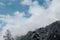 Beautiful view on Mount Ortler with glacier and clouds in sunny winter day, clouds