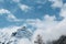 Beautiful view on Mount Ortler with glacier and clouds in sunny winter day, clouds