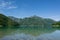 Beautiful view of mountain reflections in the water of Lago Di Ledro, Italy