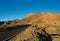 Beautiful view of the mountain ridge and road on the way to Telerifico Cable Car. Pico del Teide national park on