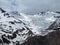 Beautiful view of the mountains in the area of Elbrus. Panorama overlooking the top of the mountain covered with snow Cheget