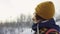 A beautiful view of the mountains in winter. A Young Man is Walking Up Mountain Slope. The handsome man is looking over