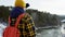 A beautiful view of the mountains in winter. A Young Man is Walking Up Mountain Slope. The handsome man is looking over