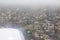 Beautiful view of the Mumbai Bombay city and cloudy weather from airplane window.