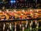 Beautiful view of nam song river with Tourist on riverside restaurant and the mountain in the night at Vangvieng city Lao