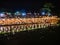 Beautiful view of nam song river with Tourist on riverside restaurant and the mountain in the night at Vangvieng city Lao