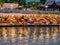 Beautiful view of nam song river with Tourist on riverside restaurant and the mountain in the night at Vangvieng city Lao.