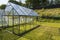 Beautiful view of newly built modern green house on back yard.