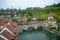 Beautiful view of Nydegg bridge on aare river with charming building and fresh green trees in downtown of Bern