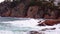 Beautiful view of the ocean coast and cliffs, waves crashing on rock coast