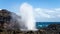 Beautiful view of an ocean with a geyser in the foreground