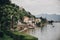 Beautiful view on old buildings and boats on lake in Stresa city, Italy. Architecture and shore on Lago Maggiore in sunny day on