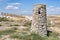 Beautiful view of an old and disused stone fireplace from an underground cellar