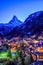 Beautiful view of old village in twilight time with Matterhorn peak background in Zermatt, Switzerland