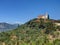 Beautiful view on orange roofing temple church on top of green hills mountains on Greece island Zakynth and blue sky. Greece lands