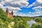 Beautiful view over German city Aschaffenburg with Main river, palace called `Schloss Johannisburg` and green park in summer