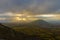 Beautiful view overlooking orange desert, distant mountains mist