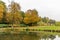 Beautiful view of a park with a gazebo and trees with a peaceful lake