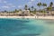 Beautiful view of people on sandy beach of hotel in Caribbean Sea on island of Curacao.