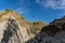 Beautiful view of a person parasailing off a mountain