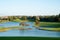 Beautiful view of a picturesque golf course with a pond