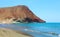 Beautiful view of Playa de la Tejita with Montana Roja Red Mountain. La Tejita beach in El Medano, Tenerife, Canary Islands,